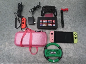 Pacchetto console Nintendo Switch 12 giochi, custodia e controller - Foto 1 di 5