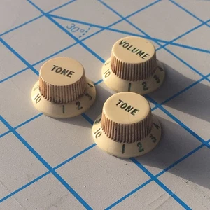 3 Spoke Fender American Vintage Reissue Strat Knobs White Aged Relic Green Fonts - Picture 1 of 8