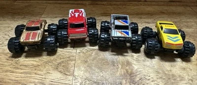 Lotto di 4 Monster Truck Micro Machines vintage Galoob 1987 (danneggiati) - Immagine 1 di 4