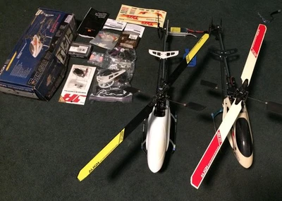 Two align trex 450 helicopters PLUS EXTRA PARTS  - Image 1 of 4