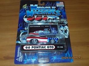 Muscle Machines Maßstab 1:64 66 Pontiac GTO Stars And Stripes 911 Tribute NEU - Bild 1 von 3