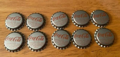 Juego de 10 tapas de botellas de plata Coca Cola sin usar con letras rojas Cincinnati OH Ohio Foto 1 de 4