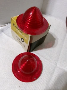 C-1-2 CORVETTE 1962-1967 TAIL LIGHT LENS PAIR NOS GUIDE - Picture 1 of 2