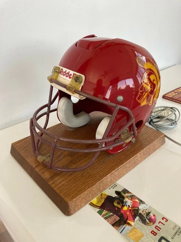 FULL SIZE USC TROJANS OFFICIAL HELMET WITH HIDDEN TELEPHONE ON A SOLID OAK BASE Cover