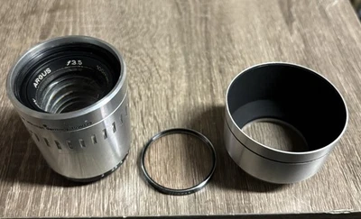 VTG Argus 100mm f3.5 Coated Cintagon Rangefinder Camera Lens W/ Hood And Filter - Image 1 of 4