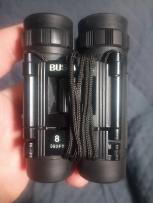 Binoculares Bushnell 8 x 21 con estuche 392 pies. A 1000YDS 392' pies. Pies 1000 yardas Foto 1 de 4