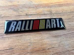 Mitsubishi Genuine RALLIART Rear Emblem Badge 60mm x 14mm - Foto 1 di 2