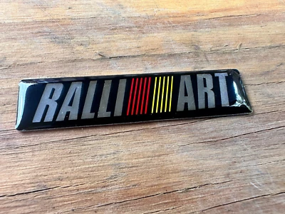 Mitsubishi Genuine RALLIART Rear Emblem Badge 60mm x 14mm - Image 1 of 2