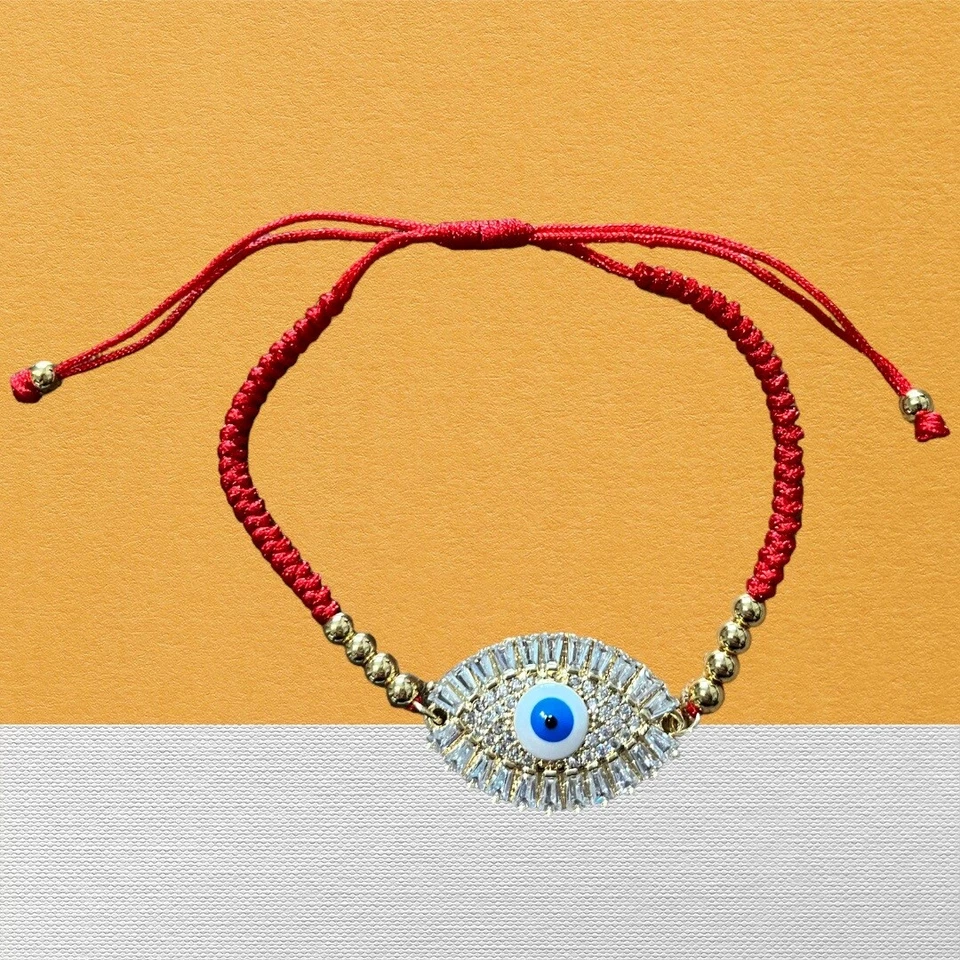 Pulcera de Hilo Rojo y Oro Laminado 14 Diferentes Ojitos Turcos para Protección Foto 1 de 1