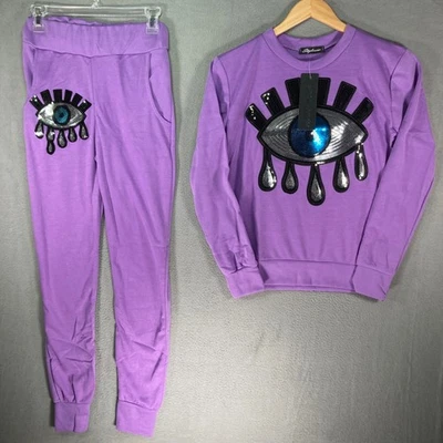 Conjunto de sudadera jogger Stylewise para mujer con lentejuelas ojos morados S M Foto 1 de 4