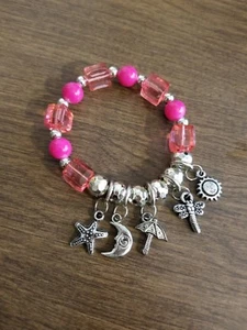 PINK BEADS STRETCH BRACELET SILVERTONE SUN/MOON/STARFISH/ETC CHARMS 7" Z3/ - Picture 1 of 1