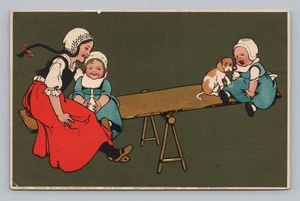 Postcard Children Playing on Seesaw c1906 - Picture 1 of 2