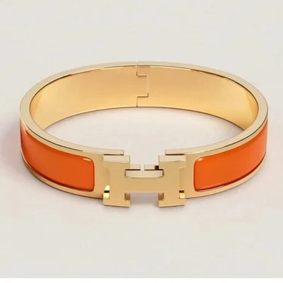 Pulsera Hermes Clic H Naranja y Oro - 16,5 cm - Usada Foto 1 de 2