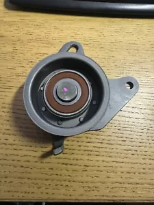 TIMING BELT TENSIONER MITSUBISHI PAJERO SHOGUN SPORT K94W MK1 2.5D - Picture 1 of 2