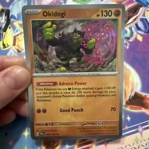 Okidogi - Holo - 057/131 - Prismatic Evolutions - NM - Picture 1 of 2