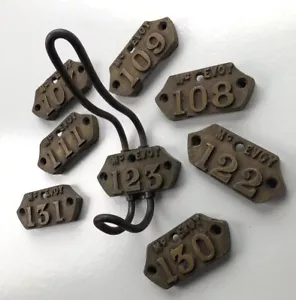 More details for lot of 8 antique mcevoy industrial school house numbered coat hook plates