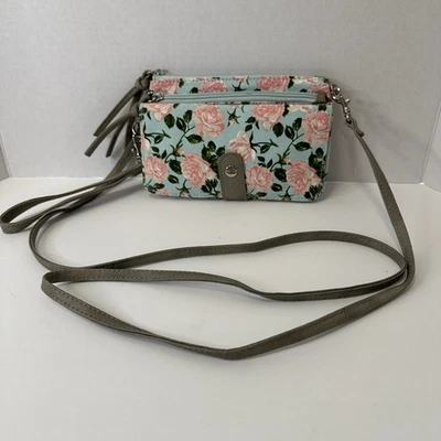 Bandolera/cartera/muñequera pequeña azul claro con patrón rosa rosa Foto 1 de 4