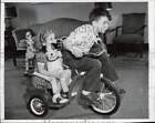 1947 Press Photo Robert Murphy gives Barbara Wiltgen a ride on a tandom tryke