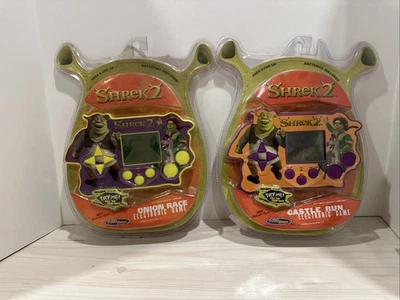 Shrek 2 Onion Race & Castle Run 2004 juego eléctrico lote de 2 nuevo sellado Foto 1 de 4