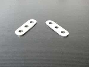 Par de soportes silenciadores universales perforados de 2 pulgadas acero inoxidable Triumph Norton Bsa - Imagen 1 de 5