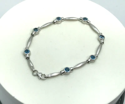 Conjunto de brazalete de eslabones de barra con forma de elipse de topacio azul redondo biseled de oro blanco de 14k 7,5" Foto 1 de 4