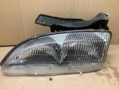 1995 - 1999 CHEVROLET CAVALIER LEFT HEADLIGHT OEM USED SOLID - Image 1 of 2
