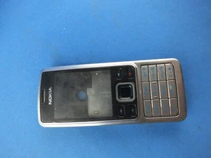 Cover do Nokia 6300 obudowa środkowa pokrywa baterii z oryginalną klawiaturą srebrna gebr. - Zdjęcie 1 z 2