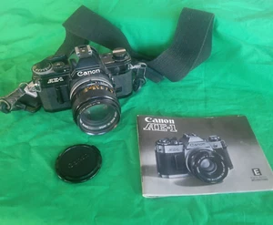 Vintage Canon AE-1 35mm SLR Film Camera with 50mm f/1.4 Lens & Instruction book - Picture 1 of 14