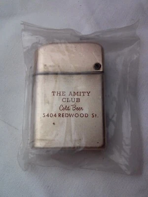 Vintage Advertising Storm Master Lighter The Amity Club Cold Beer/ The Office Go - Image 1 of 3