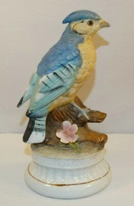 MUSIC BOX BISQUE LARGE BLUE JAY TREE STUMP PINK FLOWER PLAYS SEND IN THE CLOWN - Picture 1 of 6