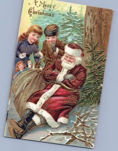 A Frohe Weihnachten gold vergoldet Weihnachtsmann sitzt unter Baum Vintage Weihnachtsmann Postkarte - Bild 1 von 2