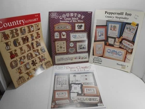 7 Different COUNTRY THEMED CROSS STITCH PATTERN BOOKS - Picture 1 of 2