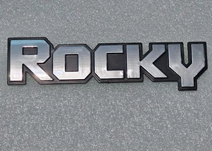 DAIHATSU TAFT ROCKY FOURTRAK FRONT FENDER NAME PLATE EMBLEM BAGDE NEW - Picture 1 of 5