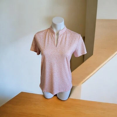 Top de golf Nike Dri-Fit Fit diseño naranja para mujer talla S. Foto 1 de 4