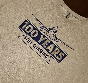 NWOT Delta AirLines 100 Year Anniversary Still Climbing Double-Sided Shirt Large - Picture 1 of 6