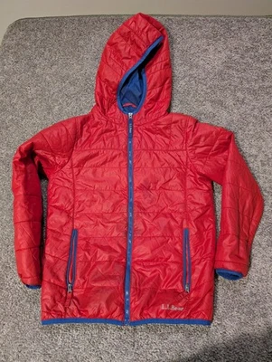 Chaqueta acolchada LL Bean para niños talla mediana azul y naranja Foto 1 de 4