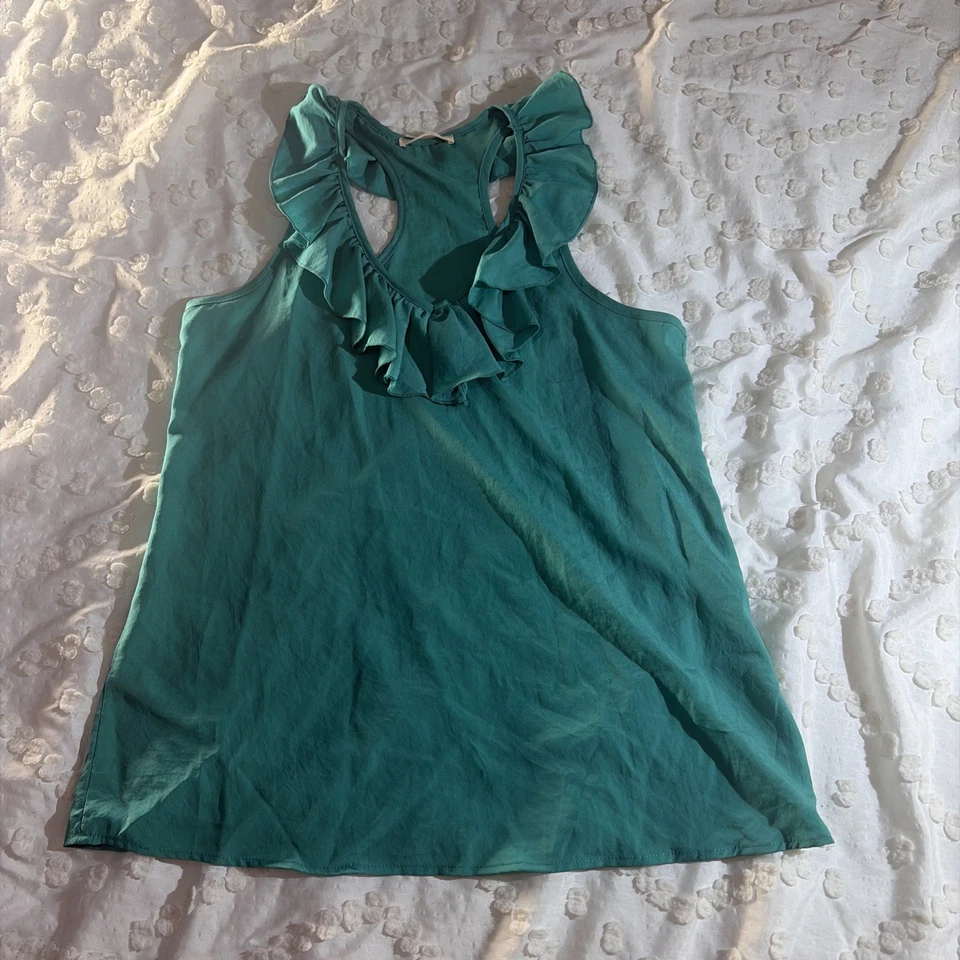 Blusa exuberante mujer talla grande sin mangas con volantes verde liso elástica Foto 1 de 4