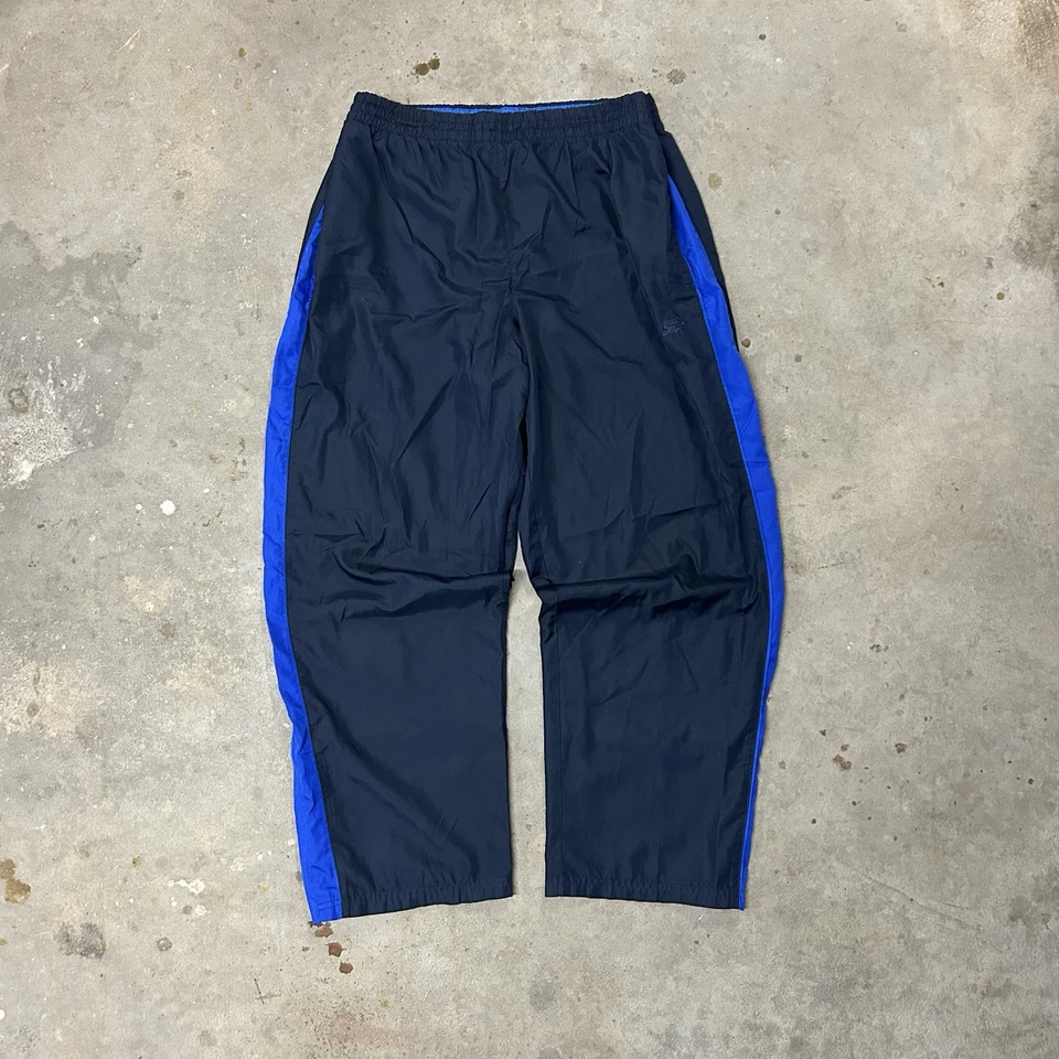 Pantalones deportivos cortavientos vintage Starter para hombre forrados en malla L pierna ancha azul Foto 1 de 4