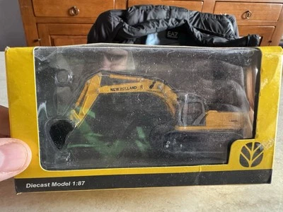 MEZZO DA LAVORO STRADALE NEW HOLLAND ESCAVATORE CINGOLI 1:87 NUOVO DA COLLEZIONE - Immagine 1 di 4