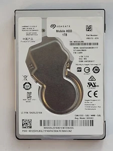 ST1000LM035, PN: 1RK172-070, SN: WDE6SLM2, WU, FW: LVM1, Seagate 1Tb 2.5" HDD - Picture 1 of 2