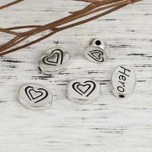 10pcs Tibetan silver HERO spacer beads with love heart 11x8mm oval shape - Picture 1 of 2