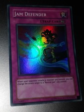 Jam Defender RP02-036 Super Rare Yugioh Card LP. RETRO PACK 2