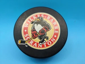 USED WBS Wilkes Barre Scranton AHL Official Game Hockey Puck Baby Penguins - Picture 1 of 5