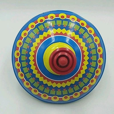 Juguete giratorio push-down Schylling 2008 vintage con tapa de hojalata. Foto 1 de 4