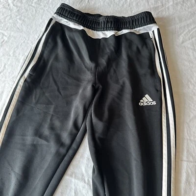 Adidas Unisex Pantalones de Pista Juveniles M Negro Blanco Tres Tiras Bolsillos con Cremallera Pierna Cónica Foto 1 de 4