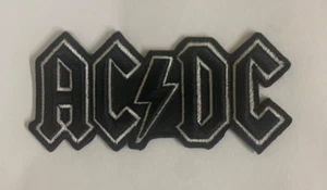 AC/DC BLACK LOGO 10CM WIDE WOVEN SEW OR IRON ON CUT OUT PATCH OFFICIAL ITEM - Picture 1 of 8