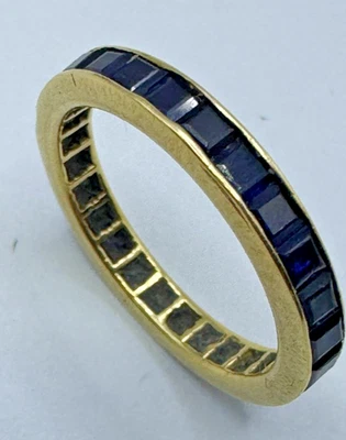 Alianza de boda de eternidad de zafiro azul de oro amarillo de 14 quilates talla 5 Foto 1 de 4