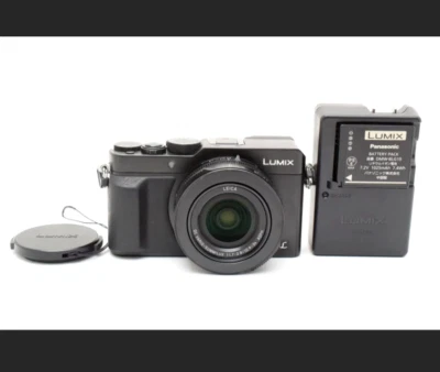 Neuwertige Panasonic LUMIX DMC-LX100 schwarz Kompakt Digitalkamera mit Ladegerät von JP - Bild 1 von 4
