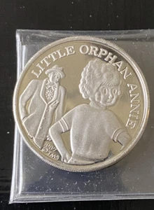 Moneda redonda de plata 0,999 Little Orphan Annie 1987 vintage de 1 oz dibujos animados celebridades - Imagen 1 de 3