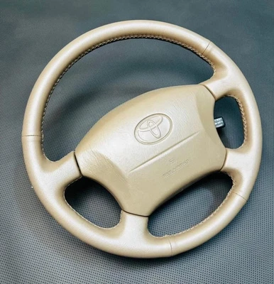 Volante Toyota Land Cruiser 100 Series, Lexus LX470 couro bordado fabricante de equipamento original - Imagem 1 de 4